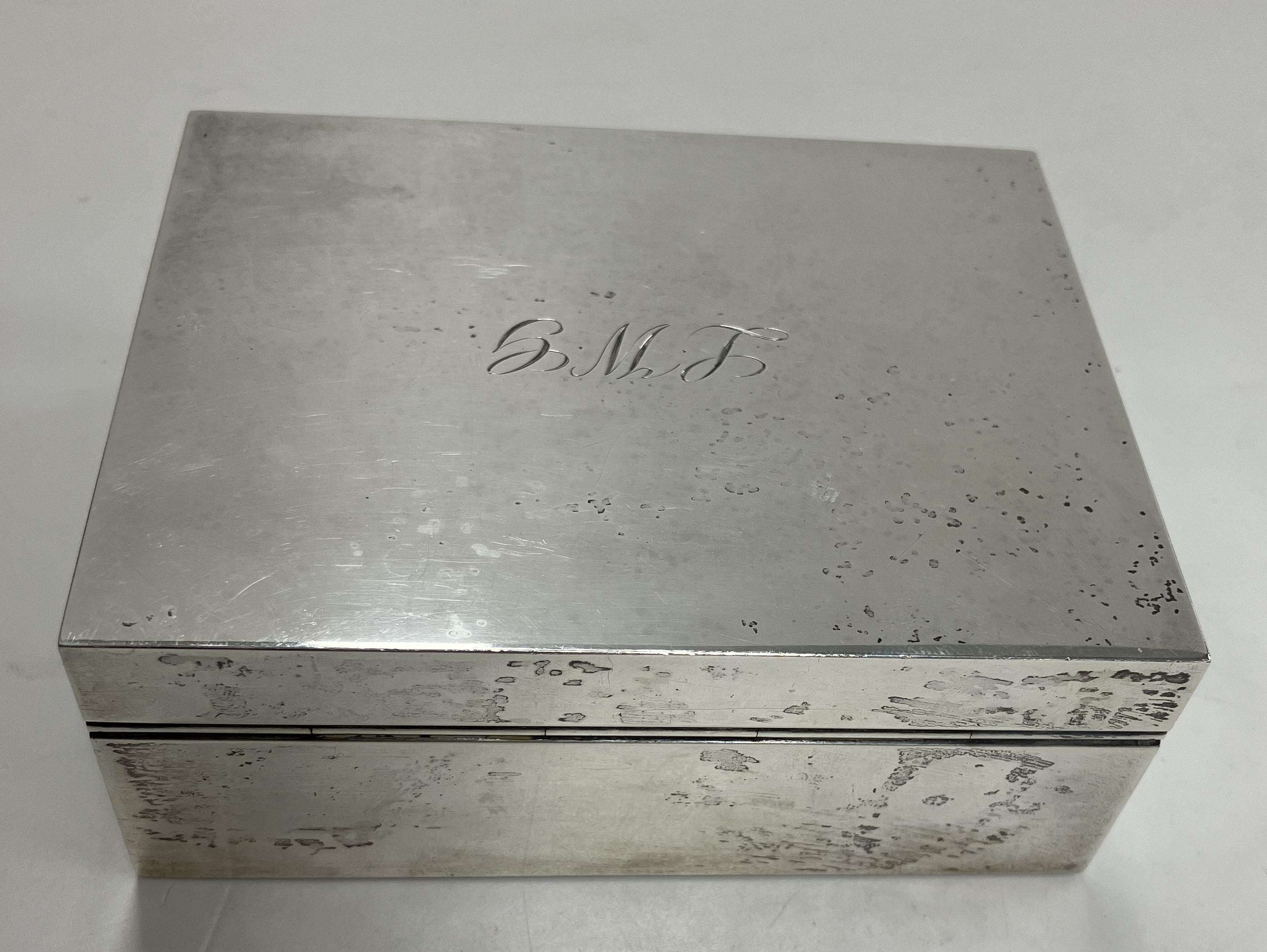 A mid 20th Century silver cigarette box, initalled to lid "LWG",