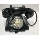 A GPO black bakelite type cased telephone stamped to base "GPO batch sampled 5862...