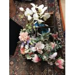 A box containing assorted fake flower arrangements to include peony etc and a string topped stool