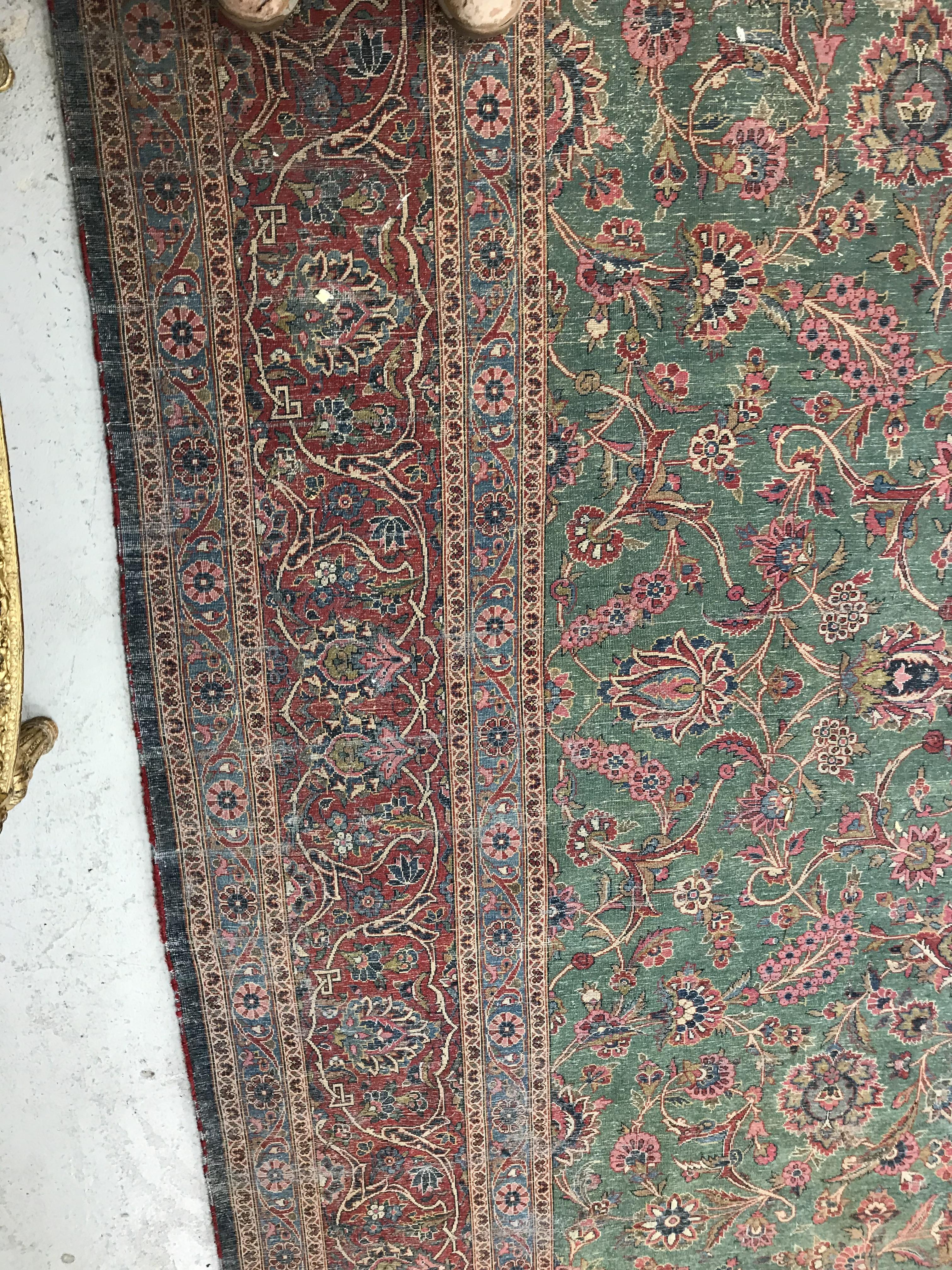 A Persian carpet, the central panel set with all-over scrolling foliate design on a teal ground, - Image 33 of 41