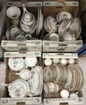 A large collection of china wares to include plates, saucers, teapots, etc.