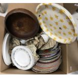 A box of miscellaneous china plates, together with a small metal tray,