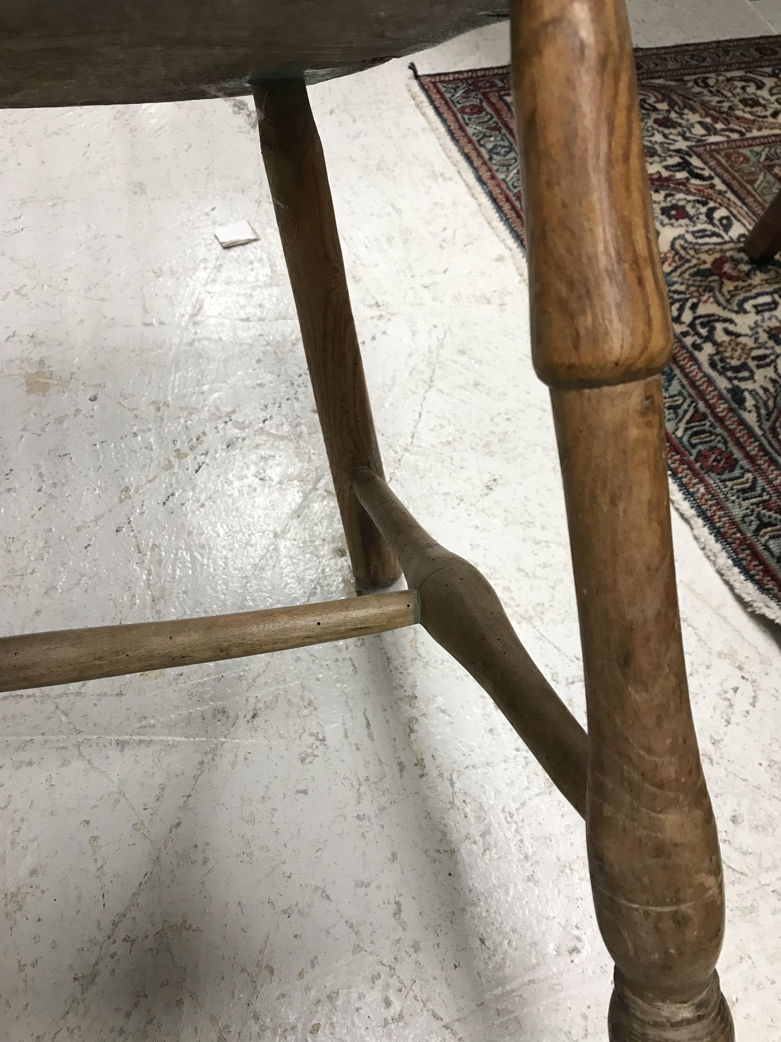 An early 19th Century West Country ash and elm stick back elbow chair, - Image 20 of 39