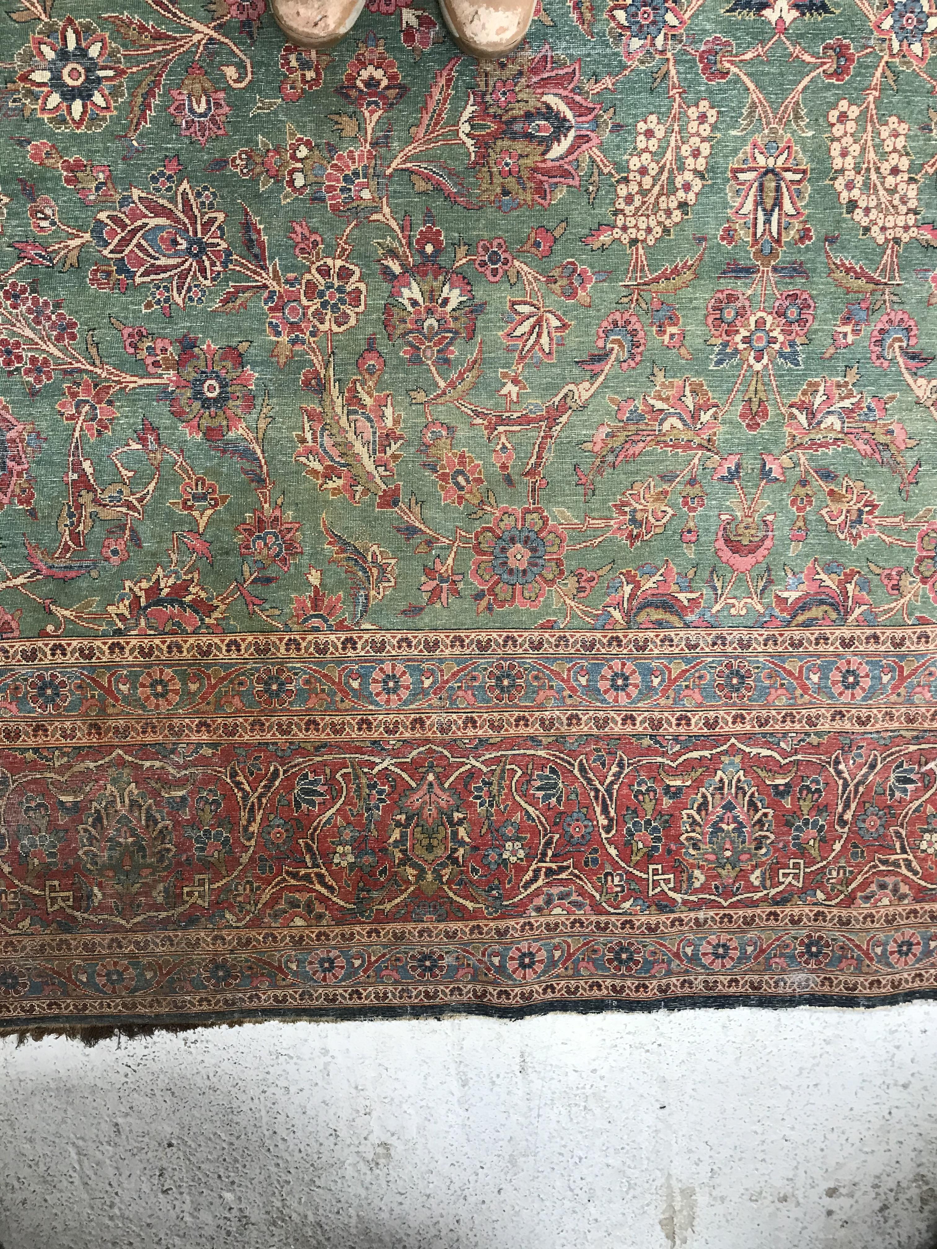 A Persian carpet, the central panel set with all-over scrolling foliate design on a teal ground, - Image 24 of 41