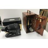 An early 20th Century Swift & Son of London brass and anodised cased monocular microscope and