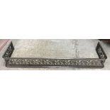 A 19th Century steel fire kerb with pierced decoration of thistles and roses emblematic of the