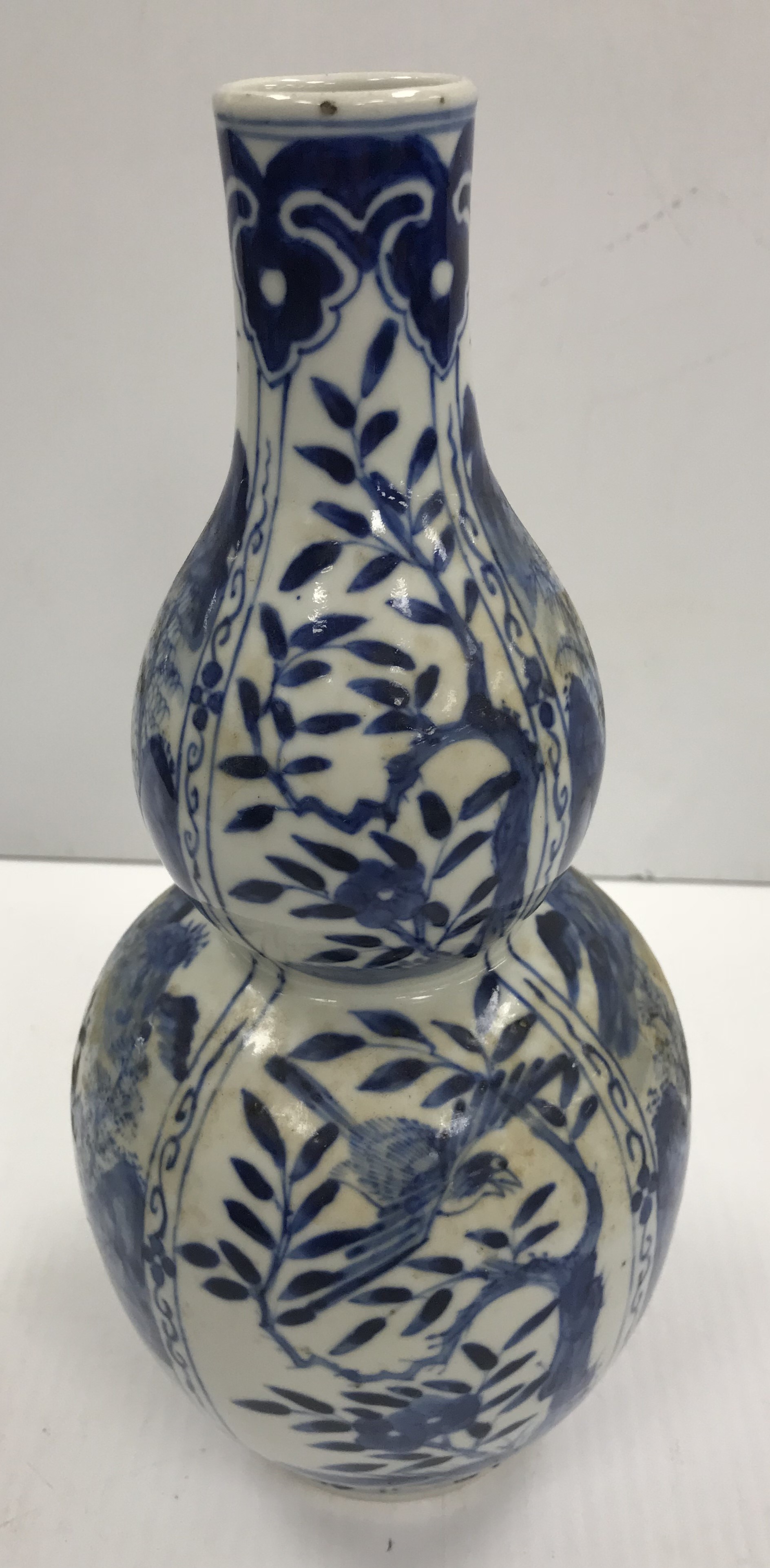 A Chinese blue and white double gourd shaped vase decorated with panels of figures in watery - Image 2 of 26