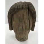 A carved treenware head study in the ancient manner 31 cm high x 19 cm wide