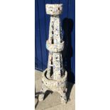 A pique assiette obelisk of stylised Eiffel Tower form with broken china mosaic decoration,