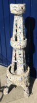 A pique assiette obelisk of stylised Eiffel Tower form with broken china mosaic decoration,