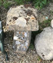 Two natural staddle stones with square tops,