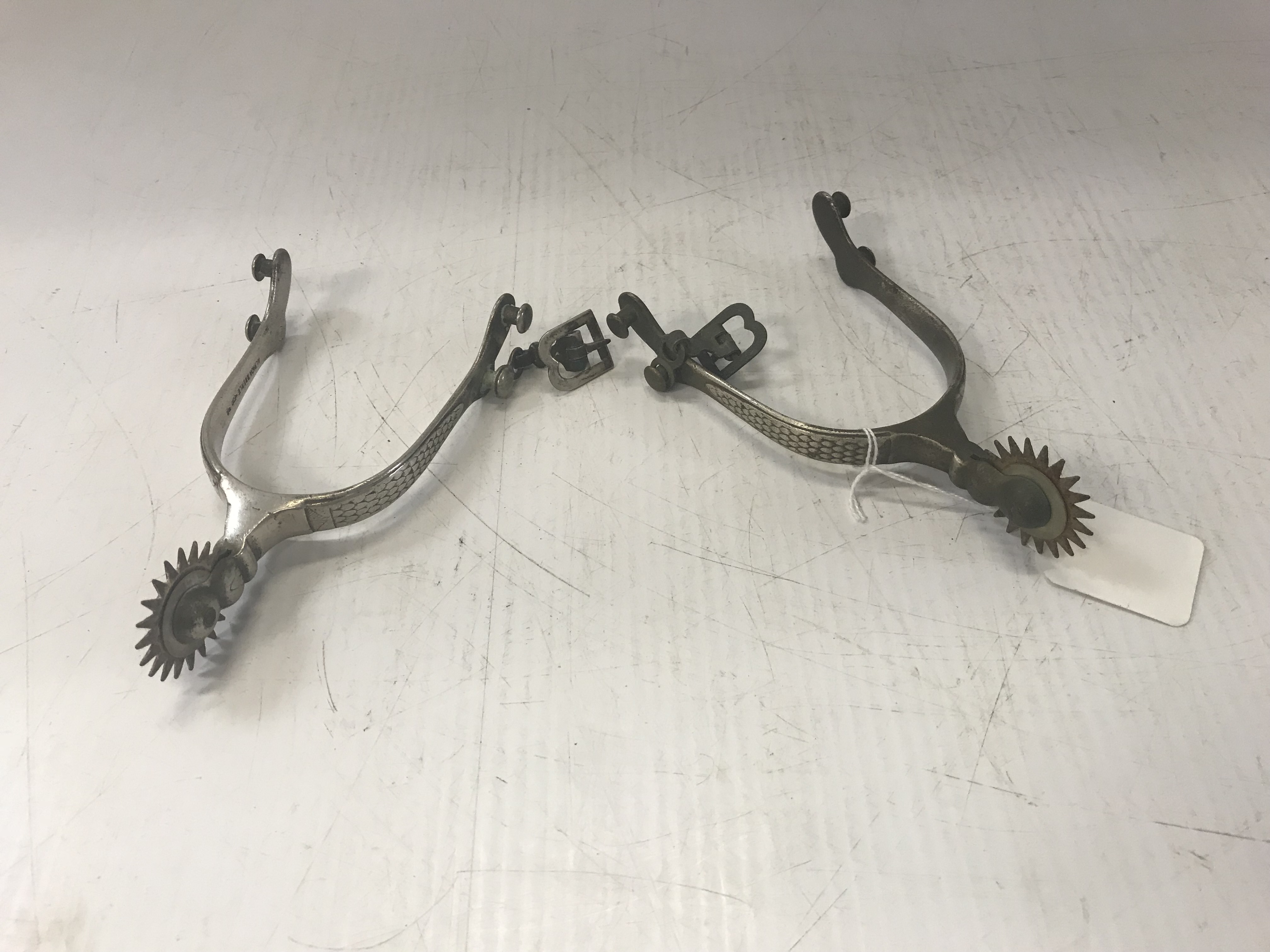 A pair of plated South American spurs stamped "Alpaca Eberle"