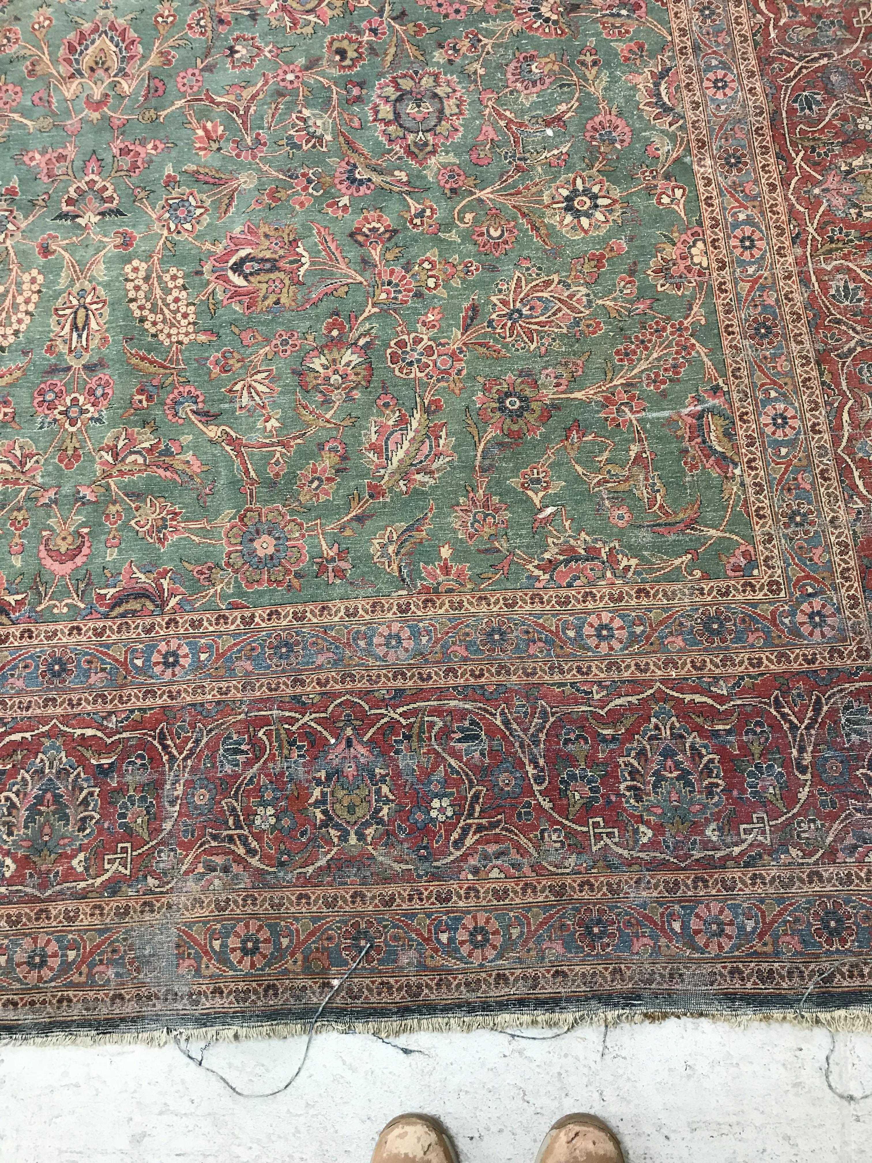 A Persian carpet, the central panel set with all-over scrolling foliate design on a teal ground, - Bild 40 aus 41