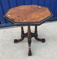 A Victorian amboyna and ebonised centre table,