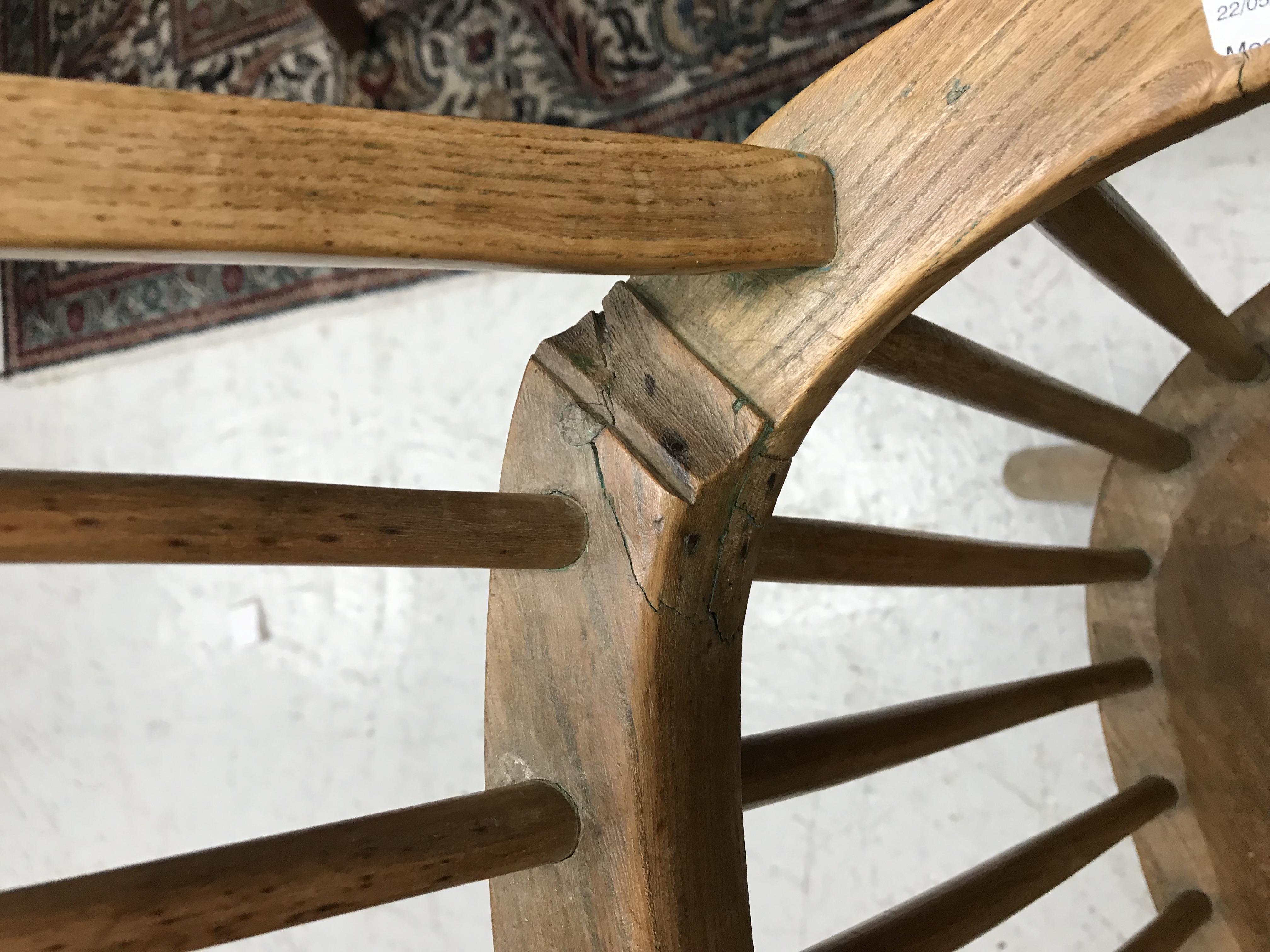 An early 19th Century West Country ash and elm stick back elbow chair, - Image 37 of 39