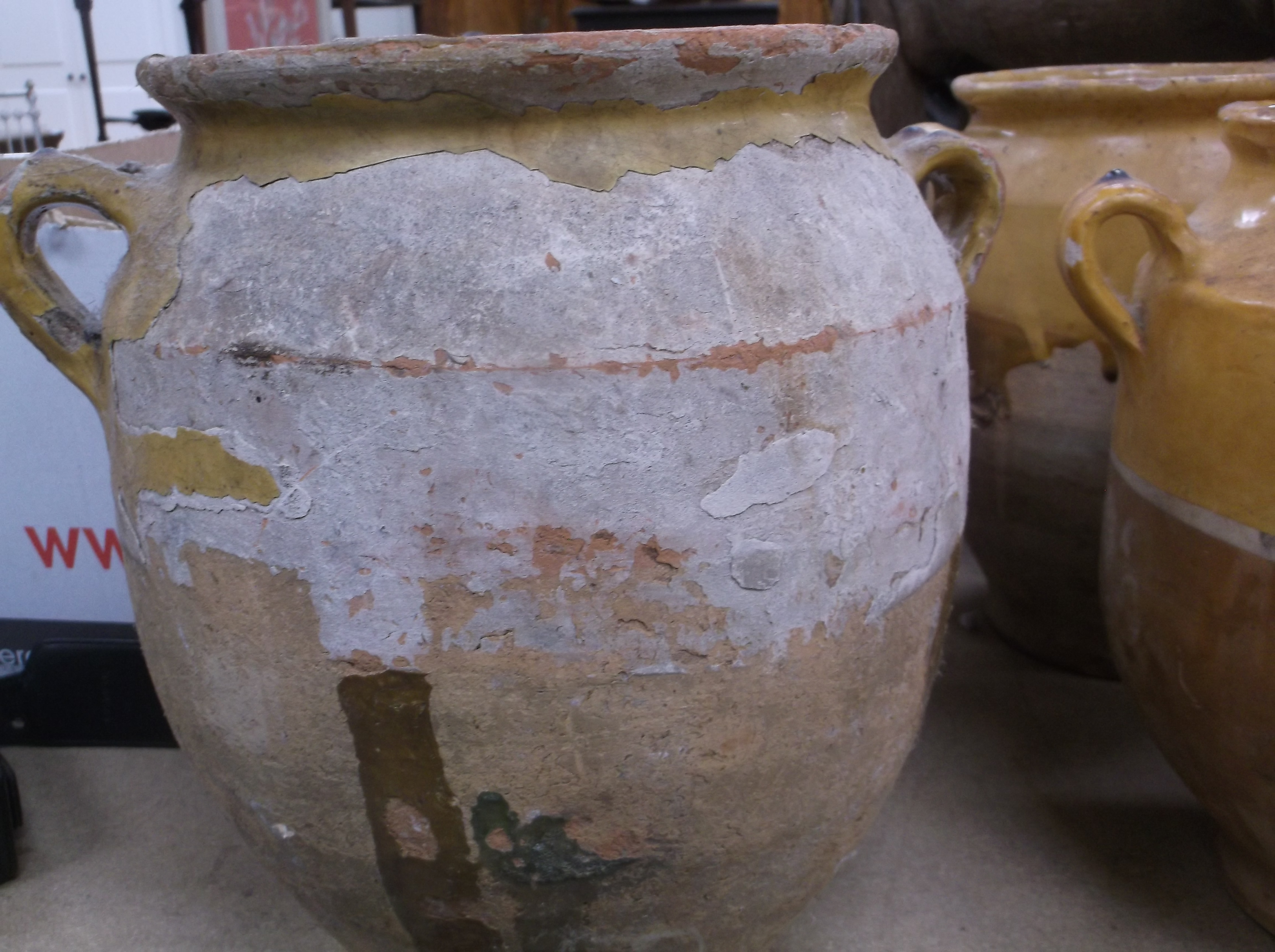 A collection of four 19th Century and later French ochre part glazed confit pots with lug handles, - Image 17 of 21