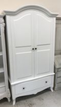 A modern white painted two door wardrobe with single drawer,