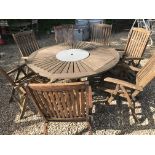 A round teak garden table with Lazy Susan centre, 160 cm diameter x 75 cm high,