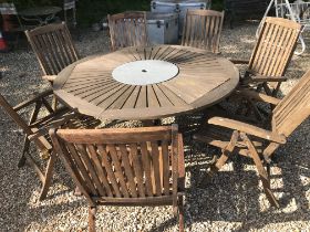 A round teak garden table with Lazy Susan centre, 160 cm diameter x 75 cm high,