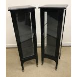 A pair of Italian ebonised bijouterie cabinets or vitrines of plain form,