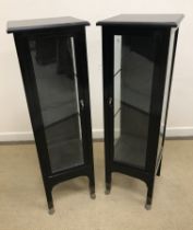 A pair of Italian ebonised bijouterie cabinets or vitrines of plain form,