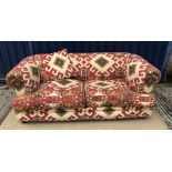 A modern Kelim style upholstered scroll arm sofa 190 cm wide x 107 cm deep x 70 cm high with