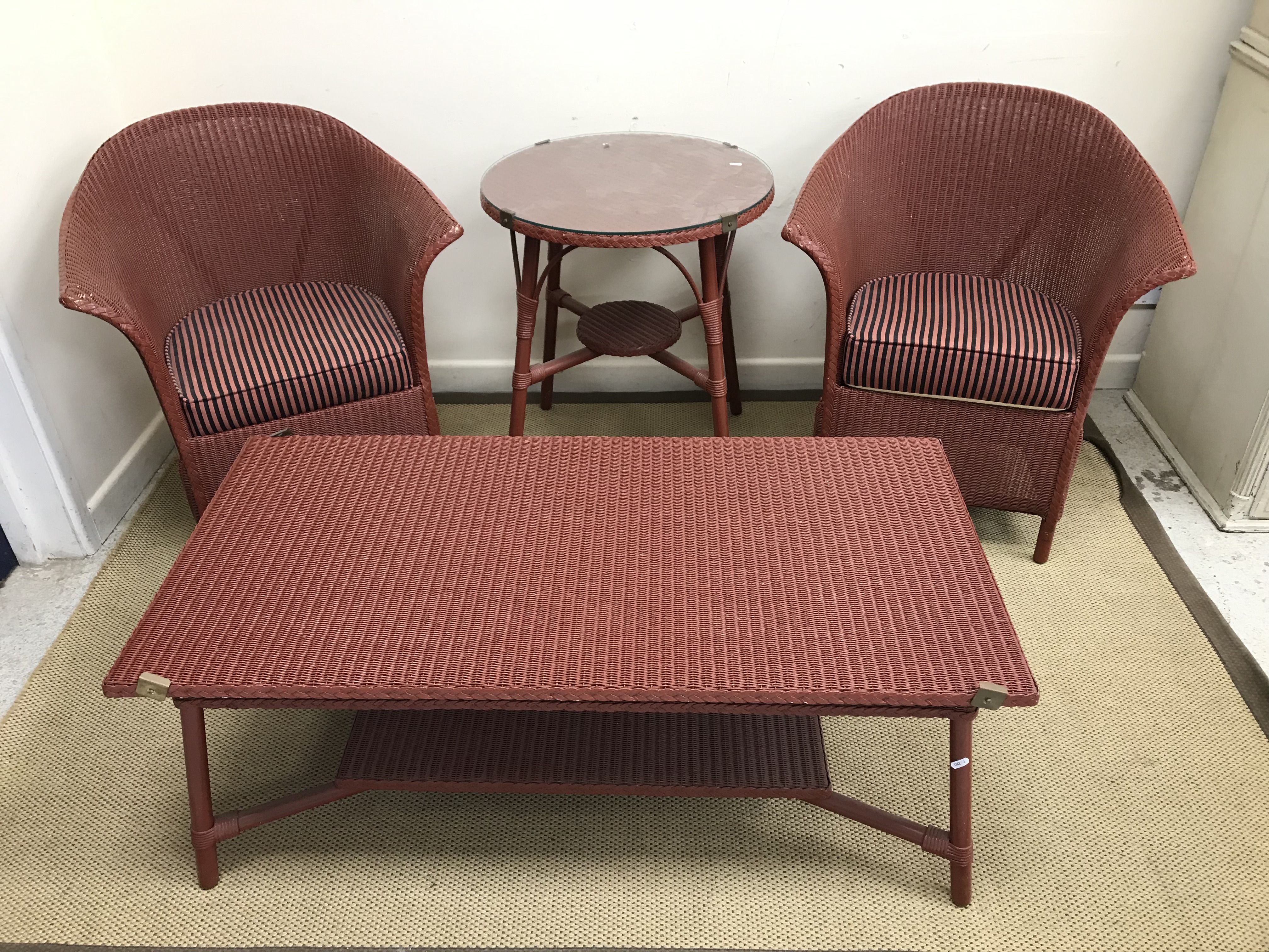 A pair of Lloyd Loom tub chairs with splayed arms, 70 cm wide x 83 cm high,