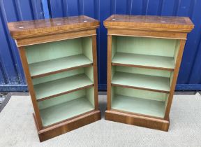 A pair of walnut open bookcases in the 19th Century manner,