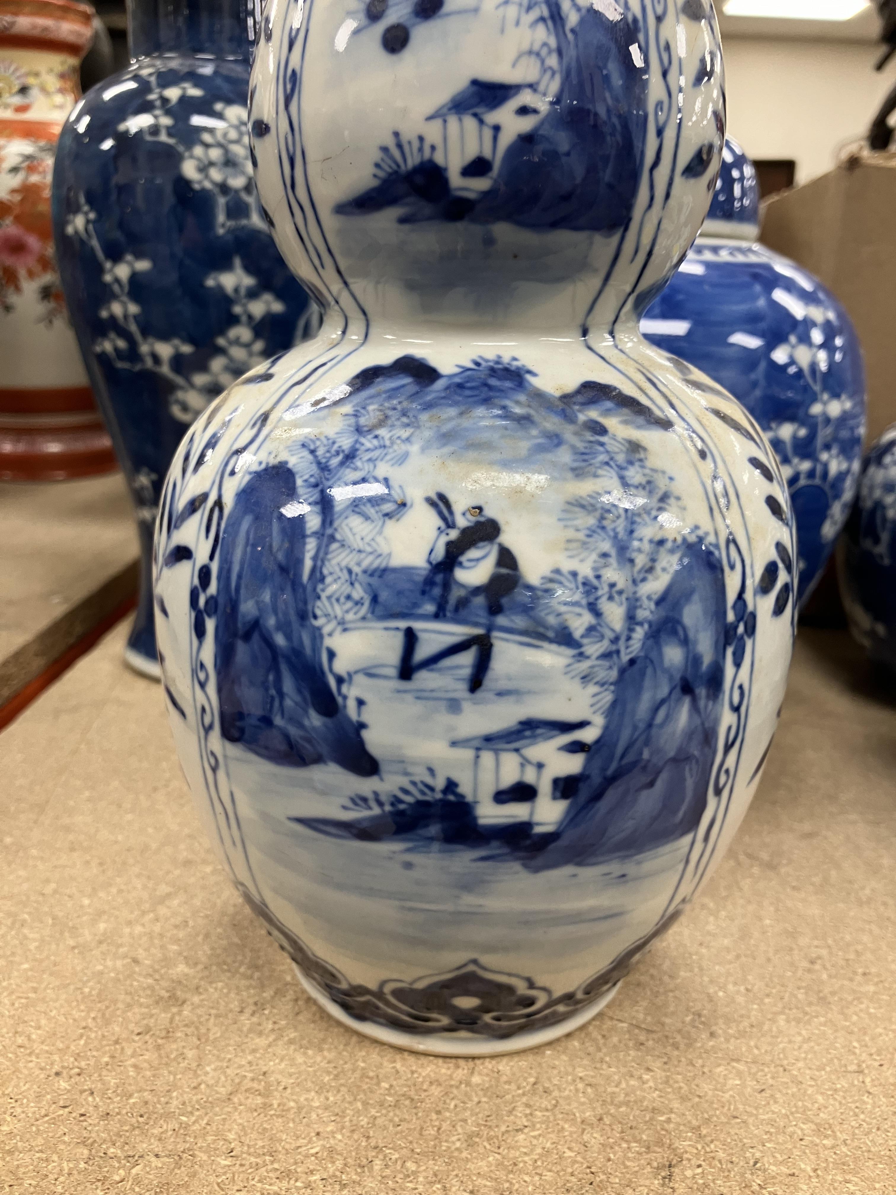 A Chinese blue and white double gourd shaped vase decorated with panels of figures in watery - Image 24 of 26