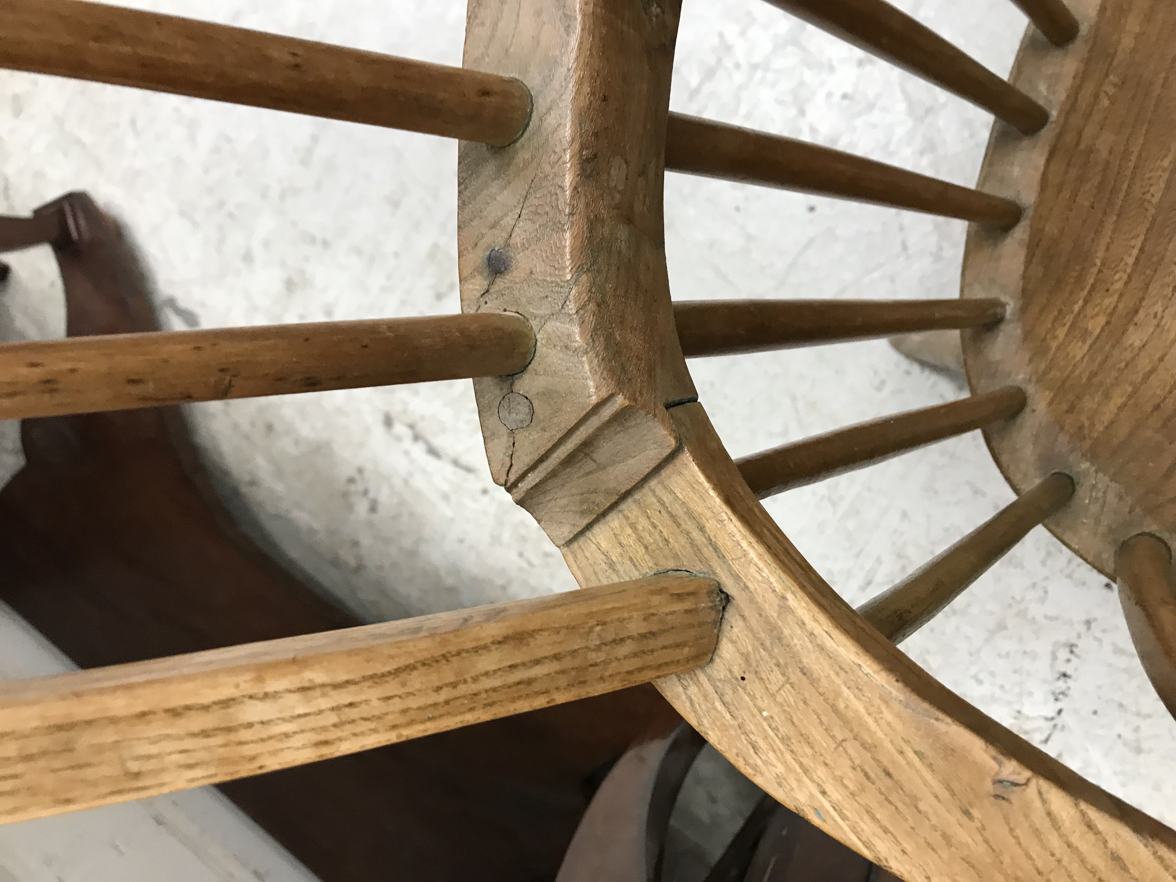 An early 19th Century West Country ash and elm stick back elbow chair, - Image 38 of 39
