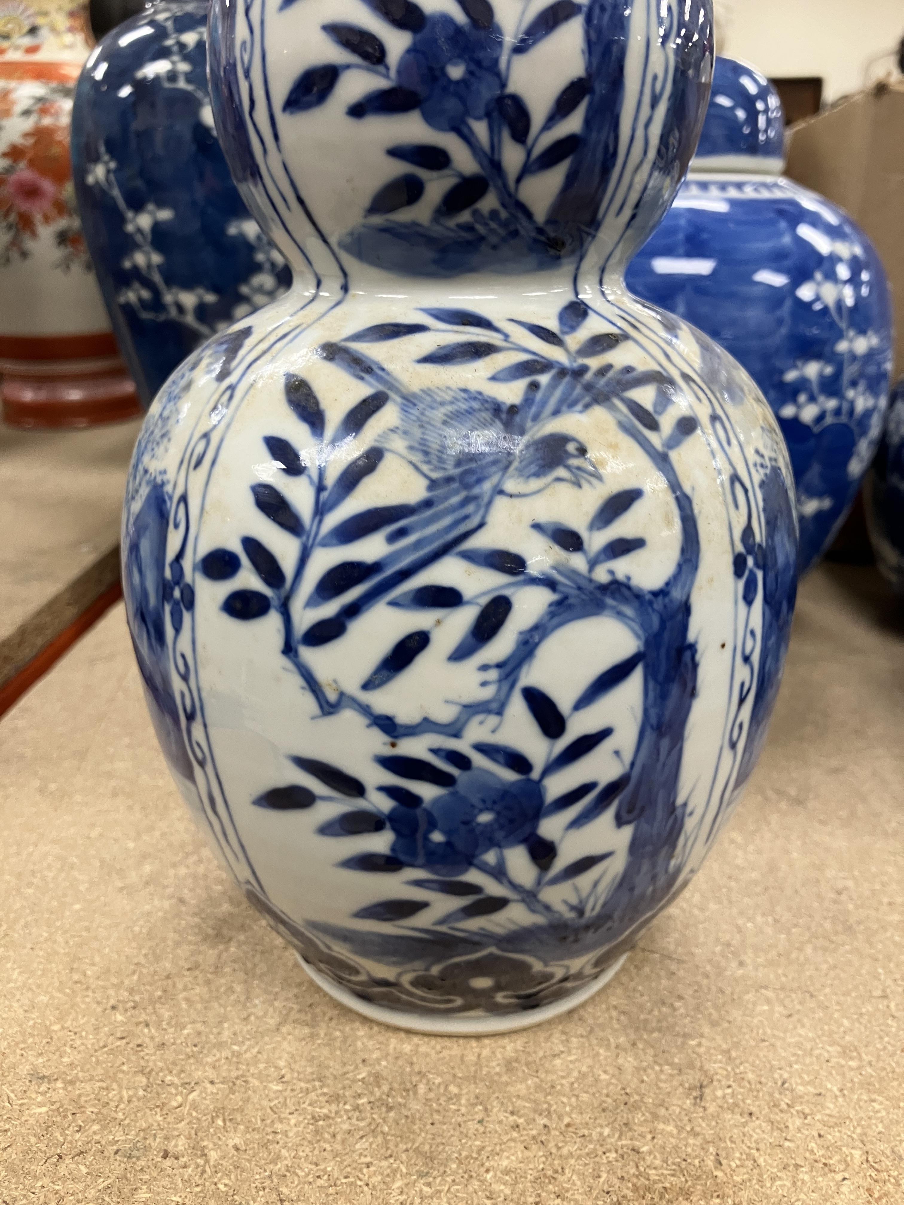 A Chinese blue and white double gourd shaped vase decorated with panels of figures in watery - Image 21 of 26