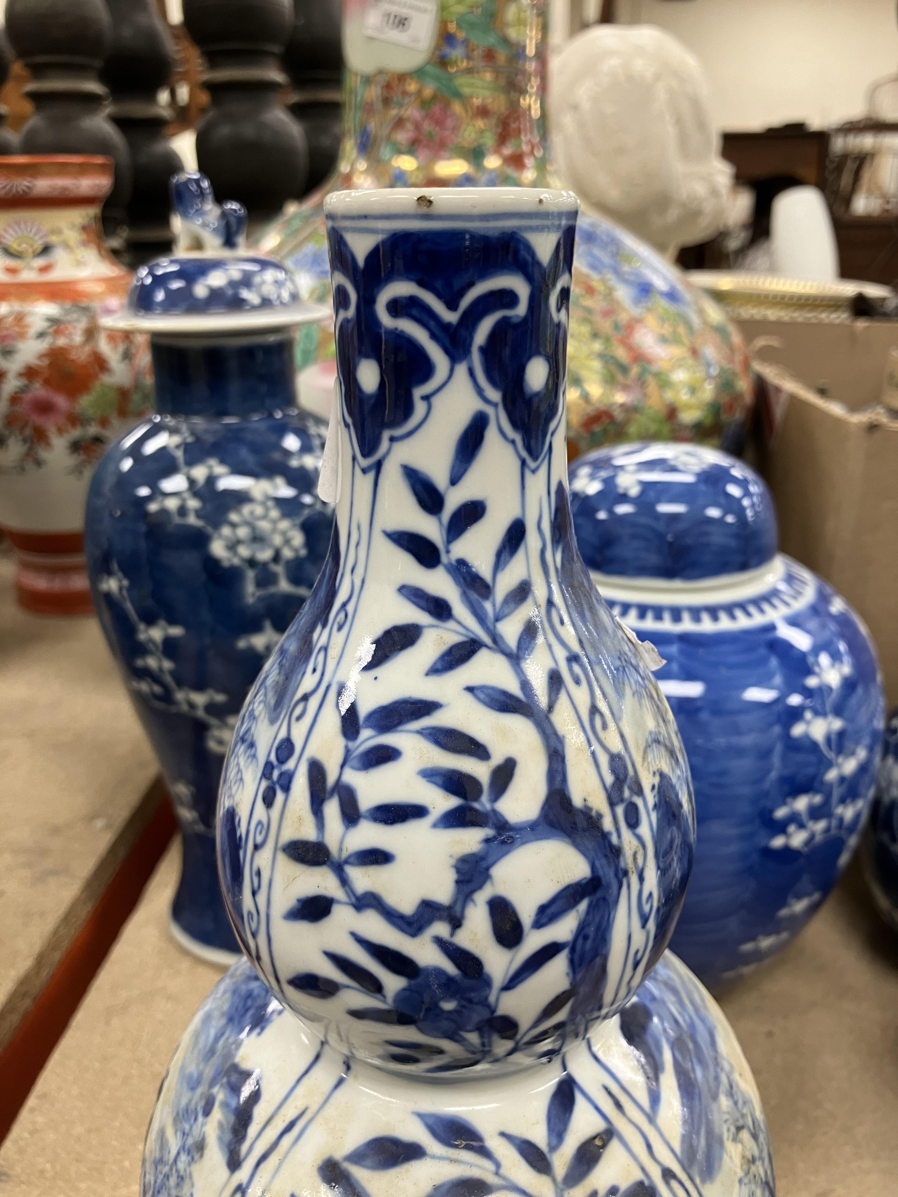 A Chinese blue and white double gourd shaped vase decorated with panels of figures in watery - Image 22 of 26