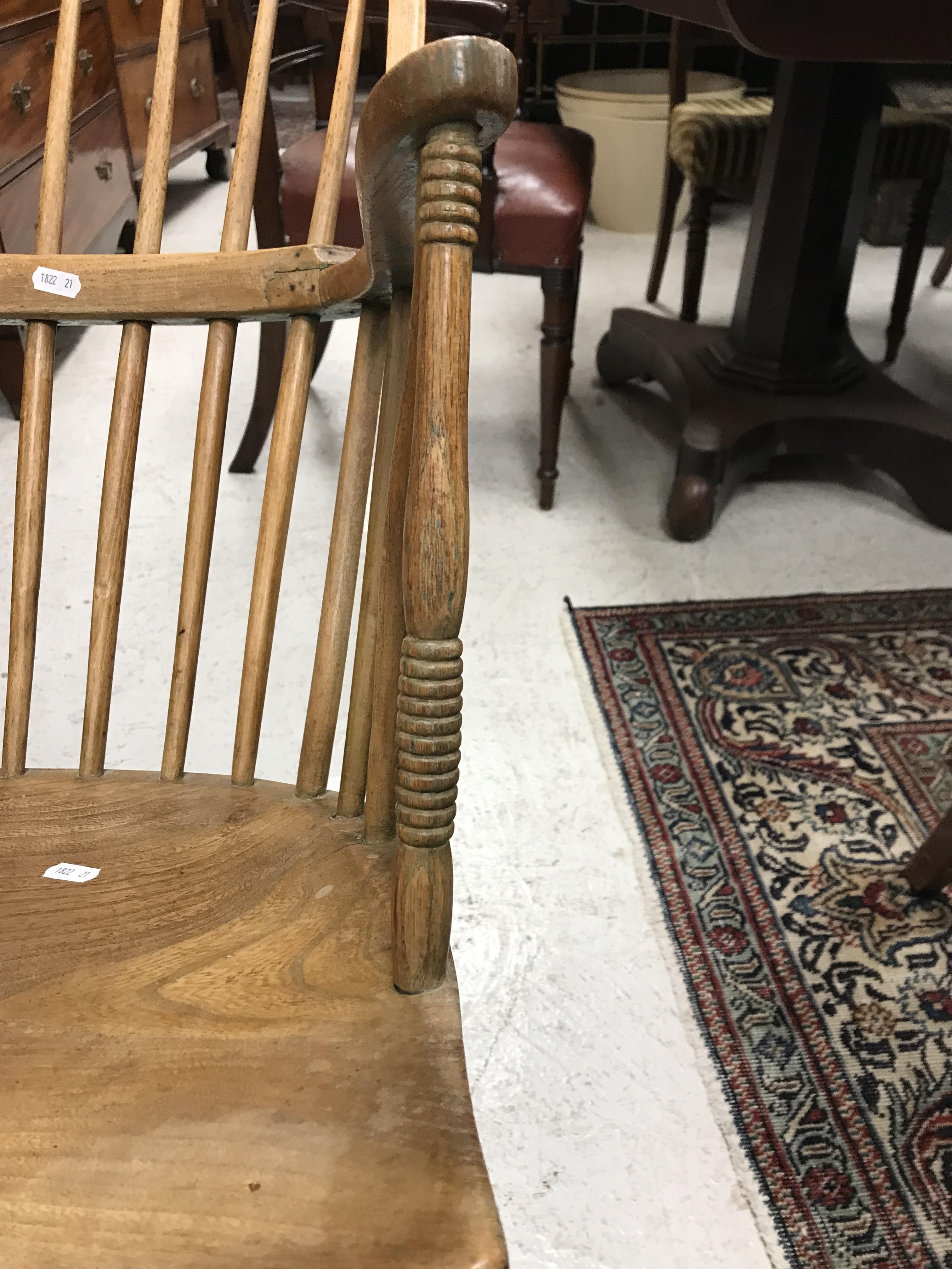 An early 19th Century West Country ash and elm stick back elbow chair, - Image 17 of 39