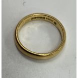 A plain gold (916) wedding band, size M / N, 5.