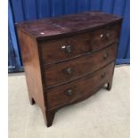 An early 19th Century mahogany bow fronted chest of two short over two long drawers on bracket feet,