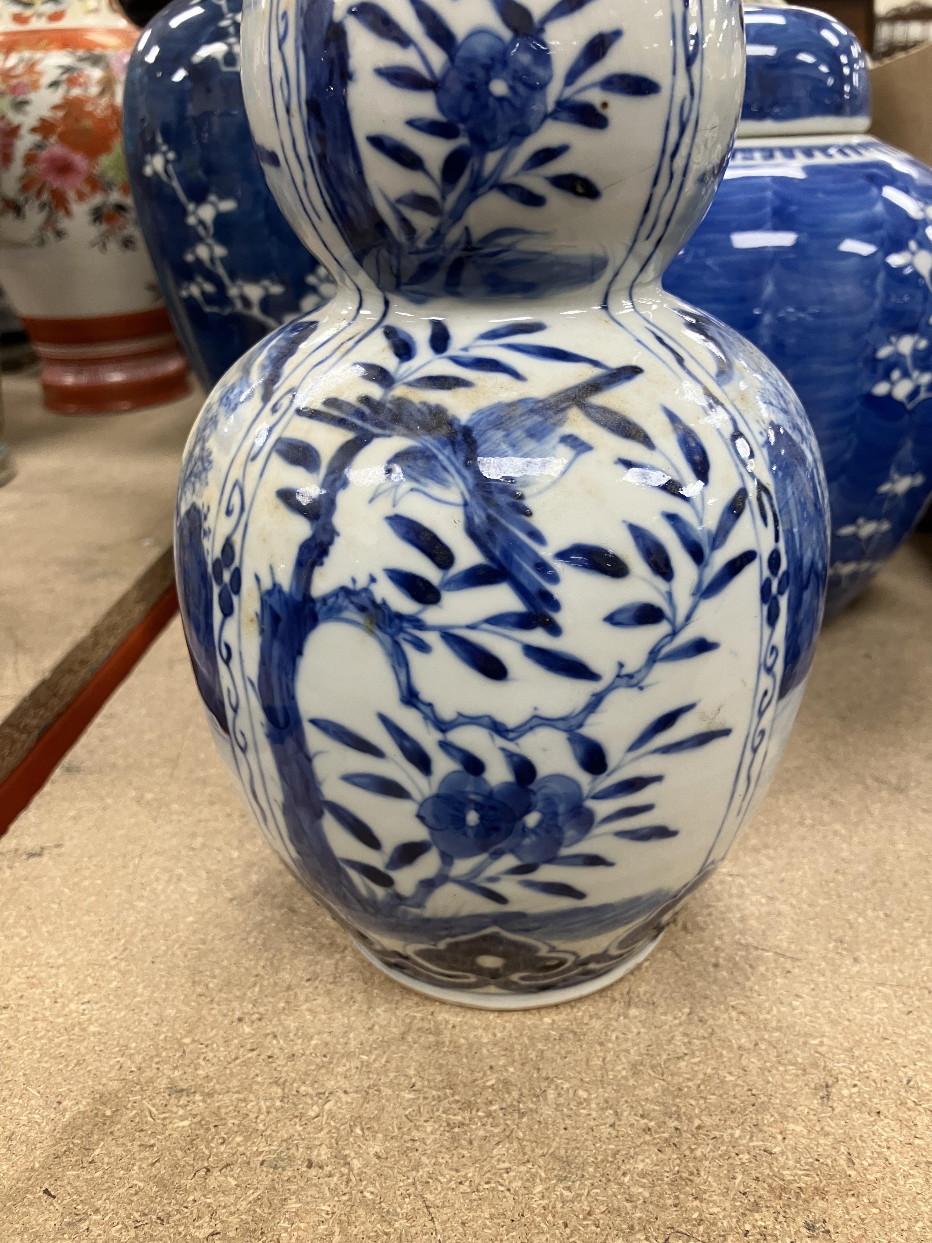 A Chinese blue and white double gourd shaped vase decorated with panels of figures in watery - Image 15 of 26