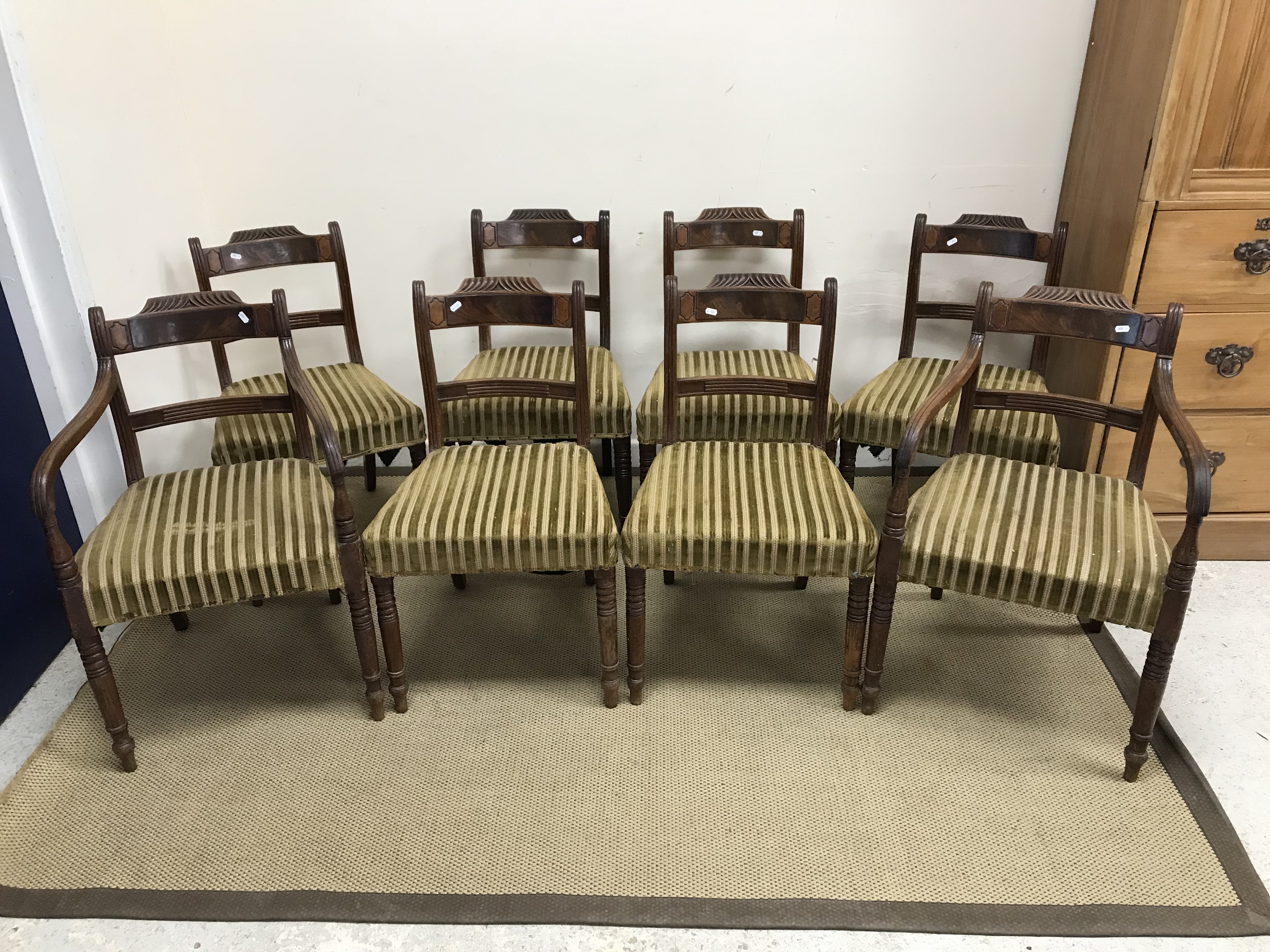 A set of eight 19th Century mahogany bar back dining chairs with upholstered seats on turned and