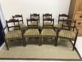 A set of eight 19th Century mahogany bar back dining chairs with upholstered seats on turned and