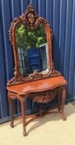 A modern mahogany console table profusely decorated scrolling foliate frieze to cabriole legs