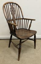 A 19th Century Thames Valley beech and elm wheel and stick back elbow chair on turned legs united