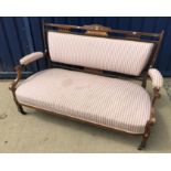 An Edwardian mahogany ivorine and marquetry inlaid settee with upholstered back seat and arms