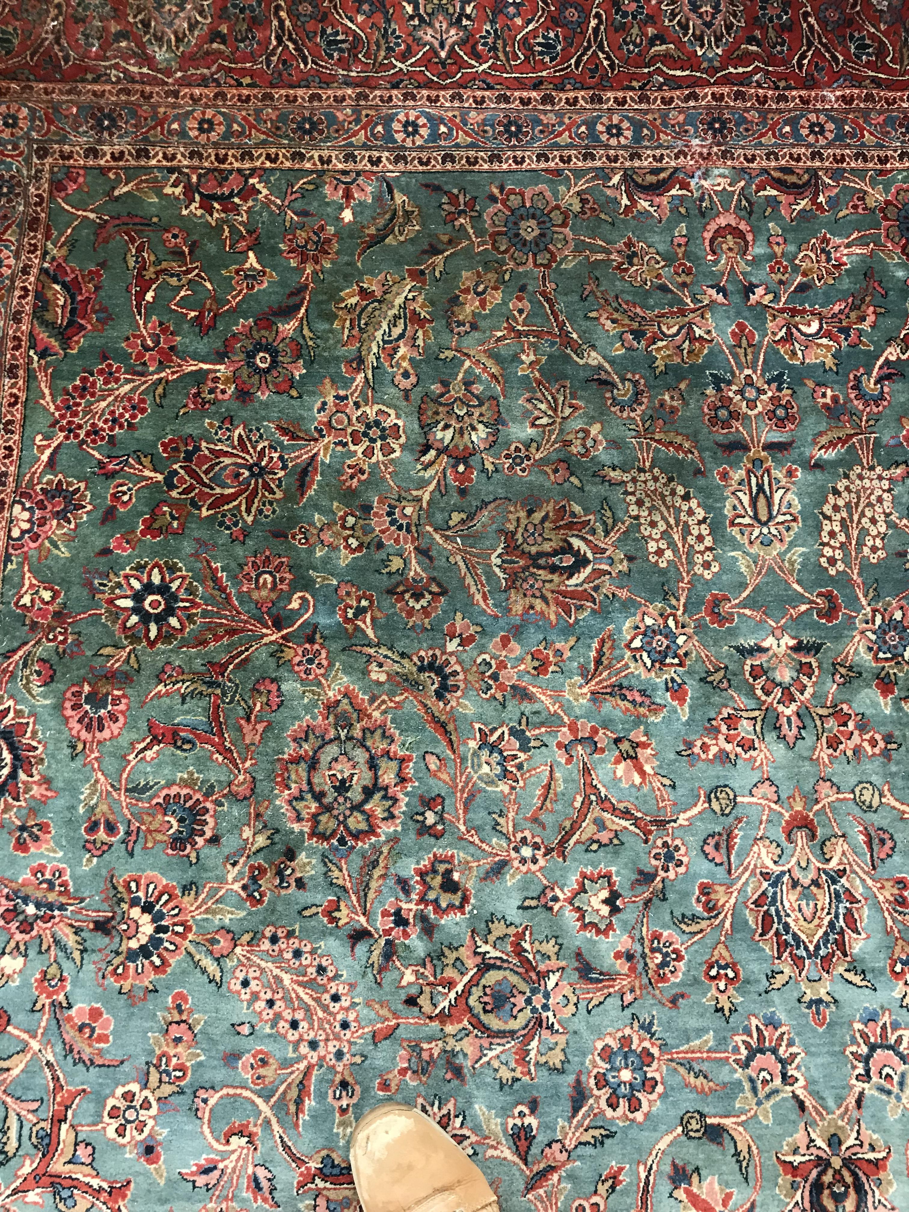 A Persian carpet, the central panel set with all-over scrolling foliate design on a teal ground, - Image 16 of 41