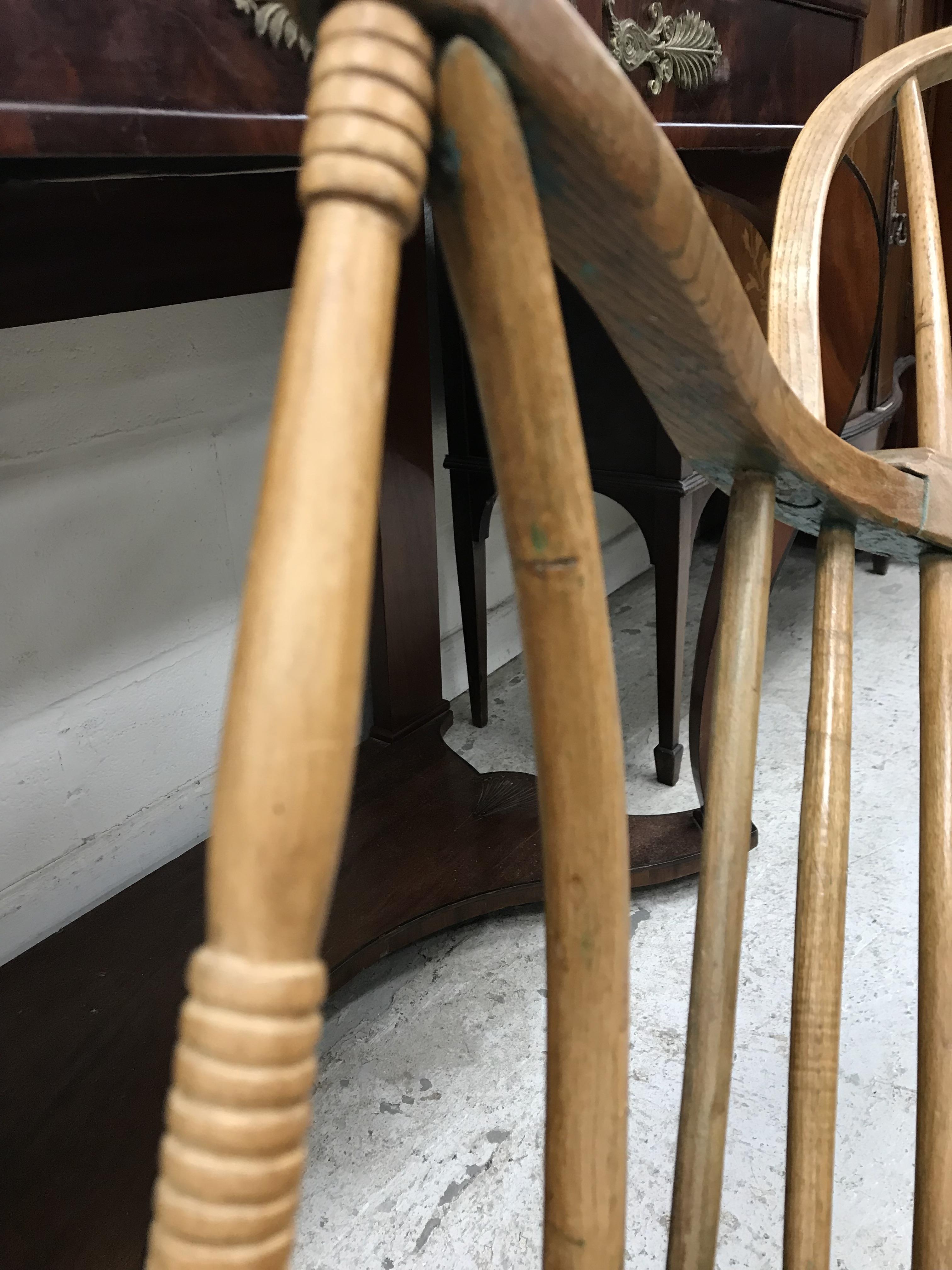 An early 19th Century West Country ash and elm stick back elbow chair, - Image 24 of 39