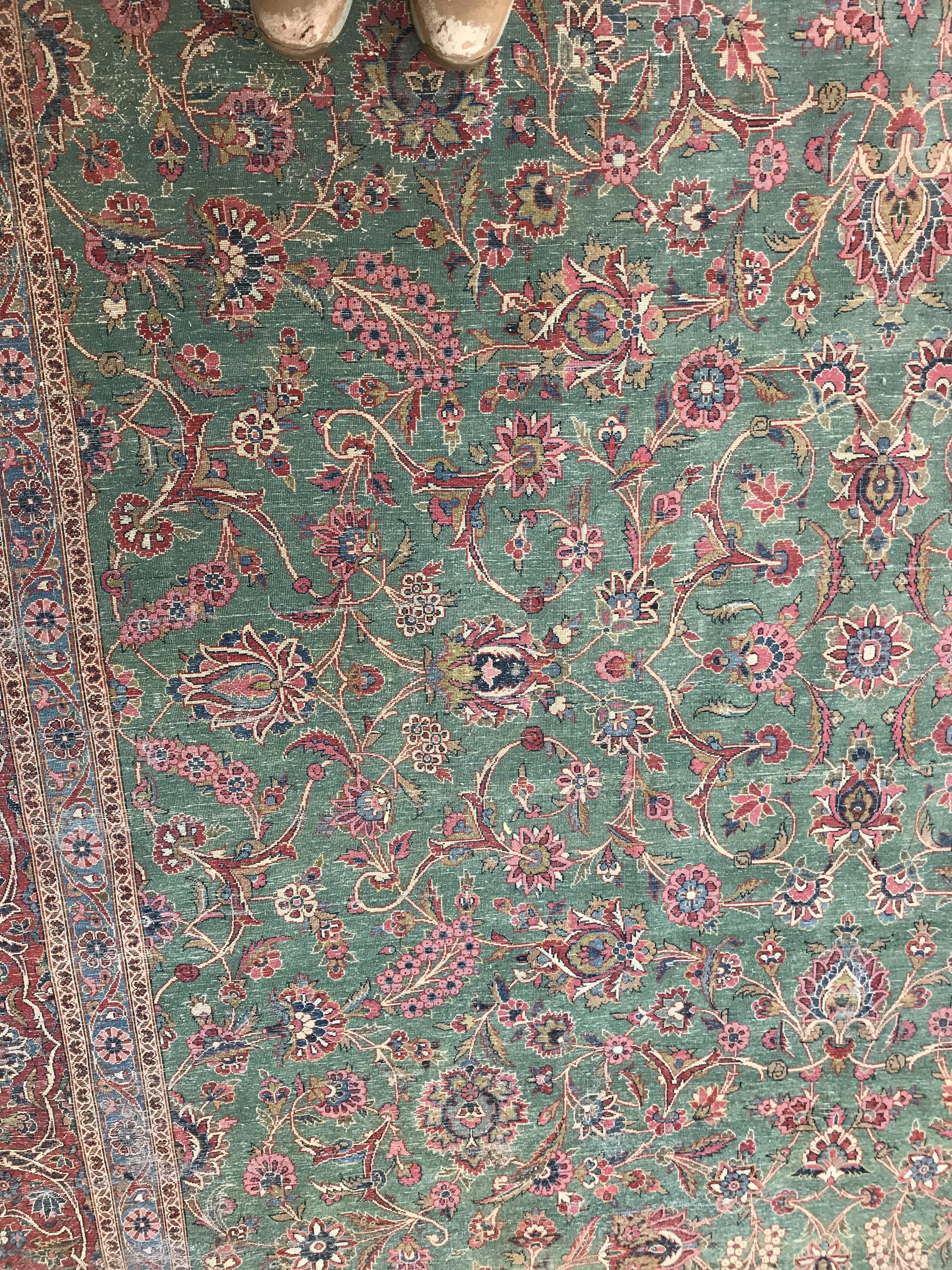 A Persian carpet, the central panel set with all-over scrolling foliate design on a teal ground, - Image 32 of 41