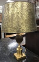 A table lamp attributed to Maison Jansen with gilded metal and resin coconut decoration and