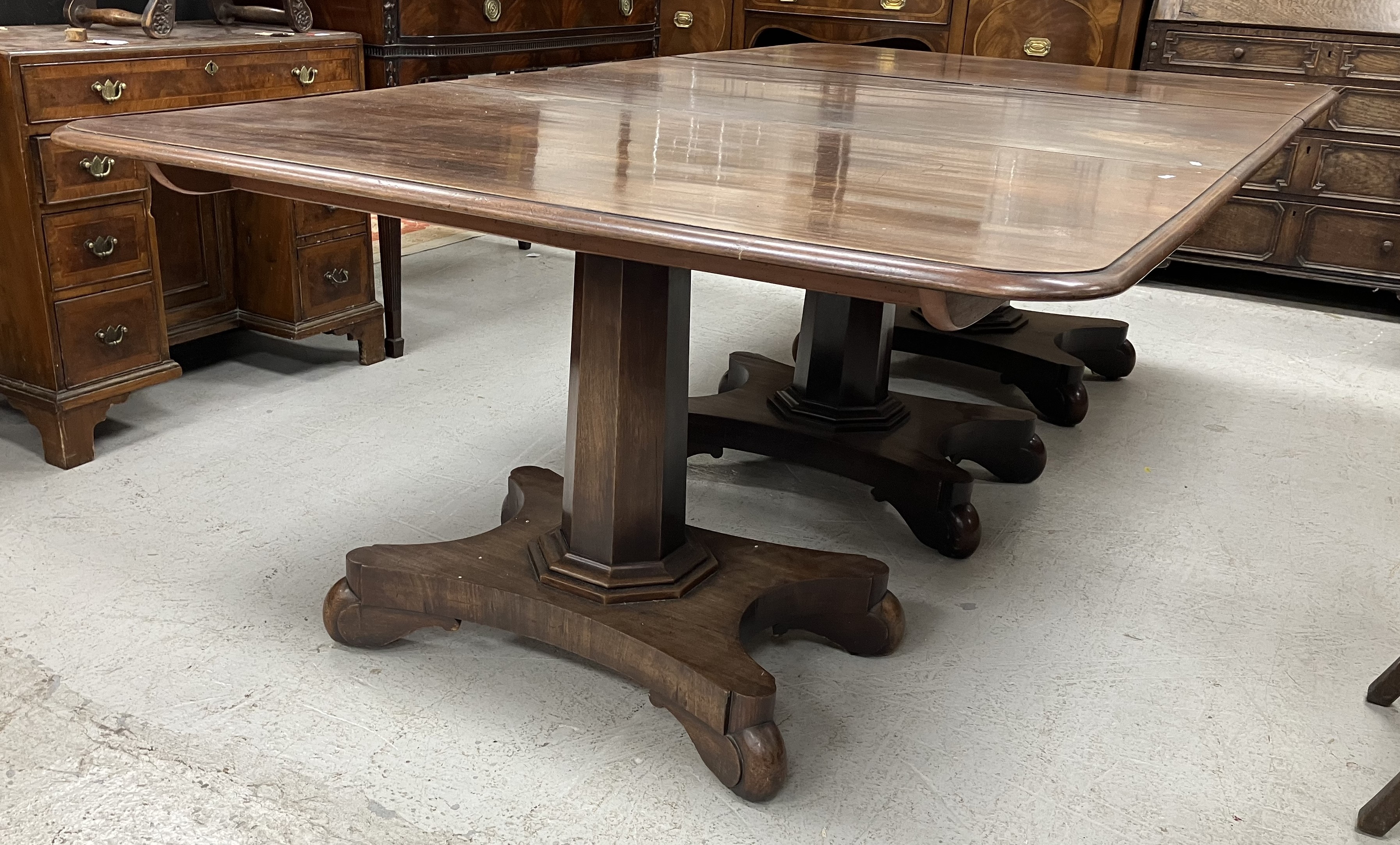 A 19th Century mahogany triple pillar dining table, - Image 4 of 38