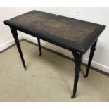 A 19th Century ebonised fold over card table by Lamb of Manchester,