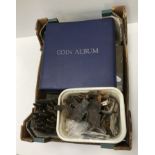 A box containing a collection of various ephemera including metal detector finds such as early