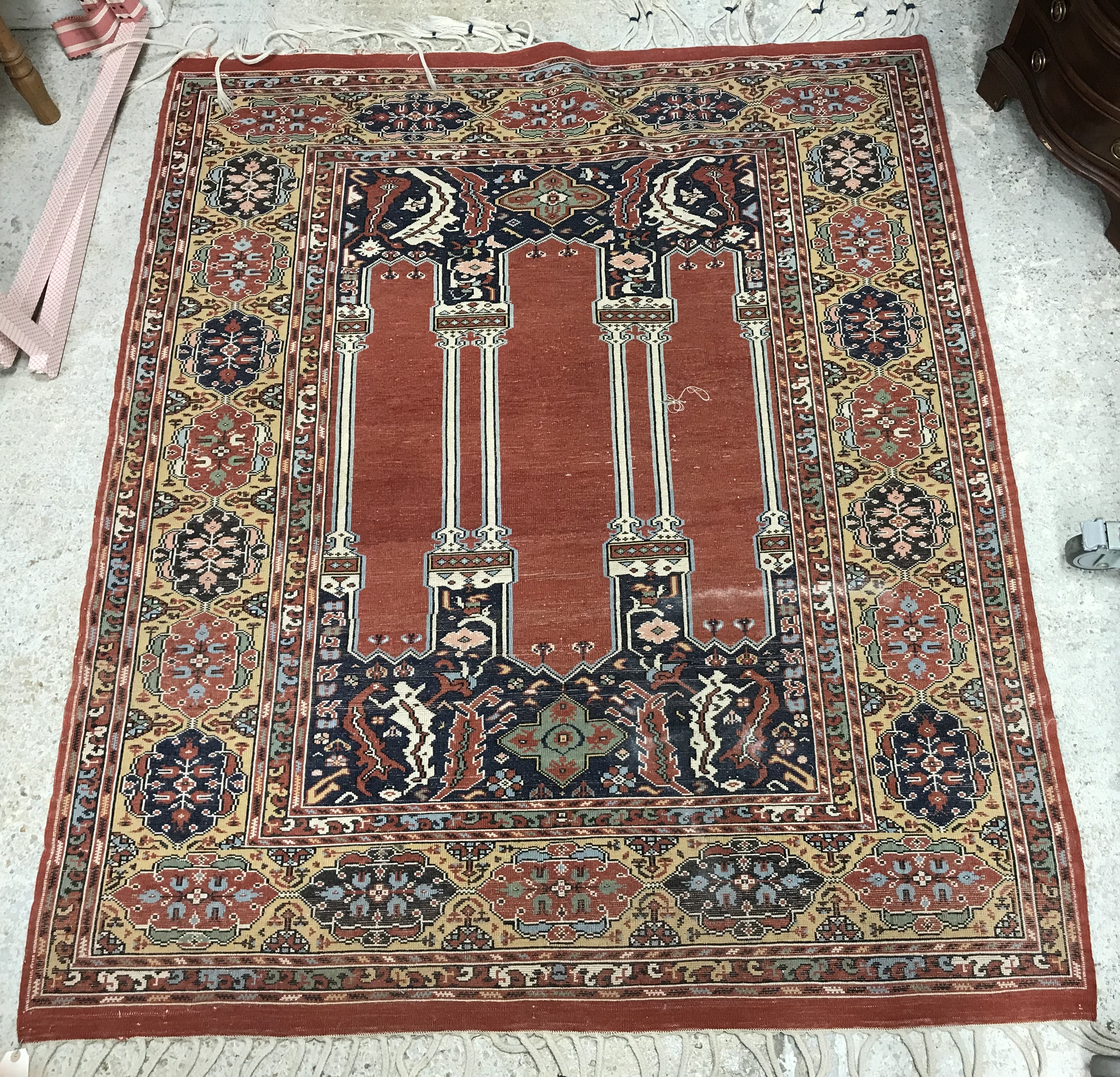 A Persian rug, the central panel set with three column design on a dark blue foliate ground, - Image 2 of 2