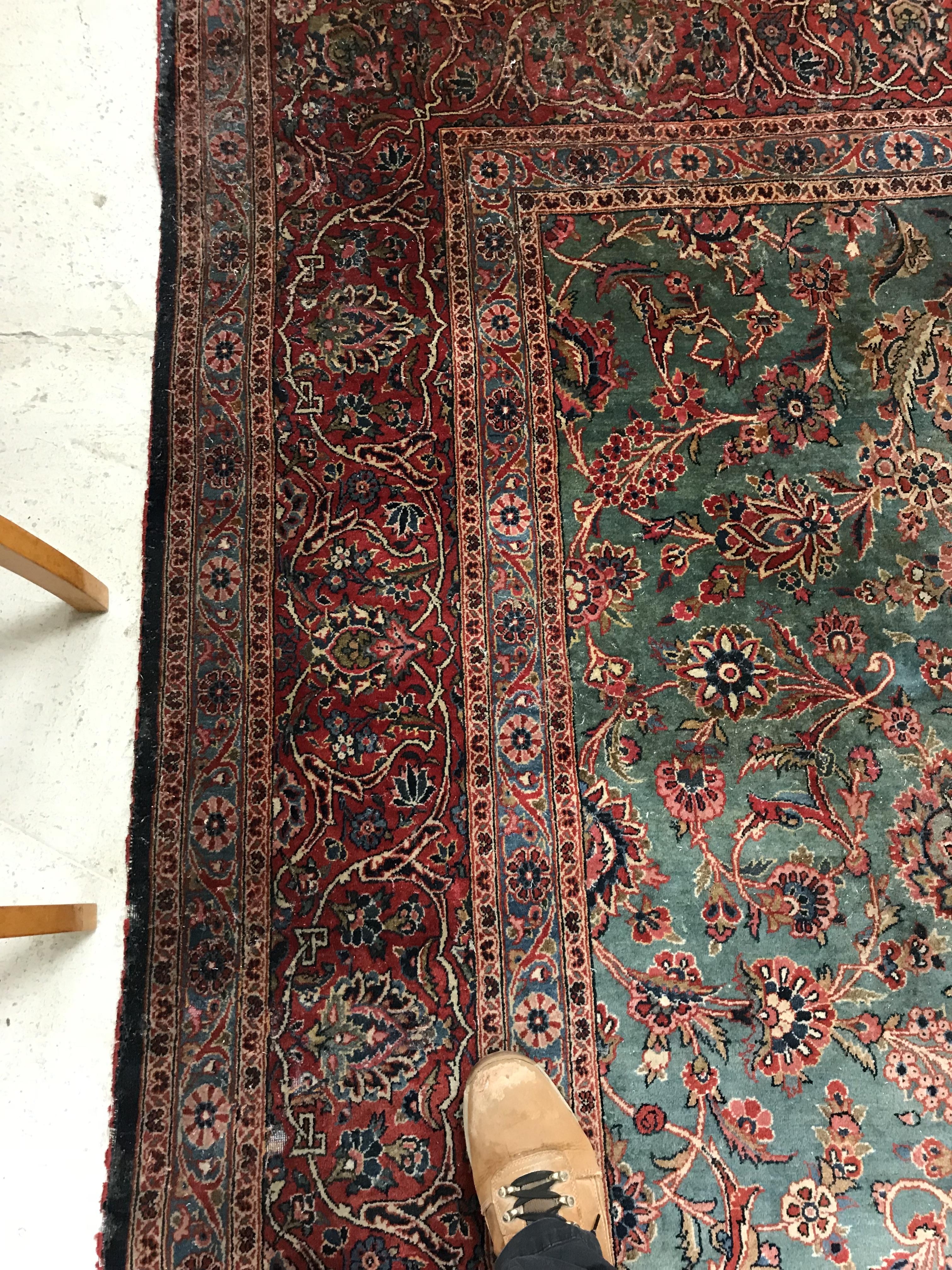 A Persian carpet, the central panel set with all-over scrolling foliate design on a teal ground, - Image 17 of 41